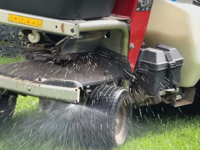 Lawn fertilizing treatment being applied to a Minnesota residential lawn